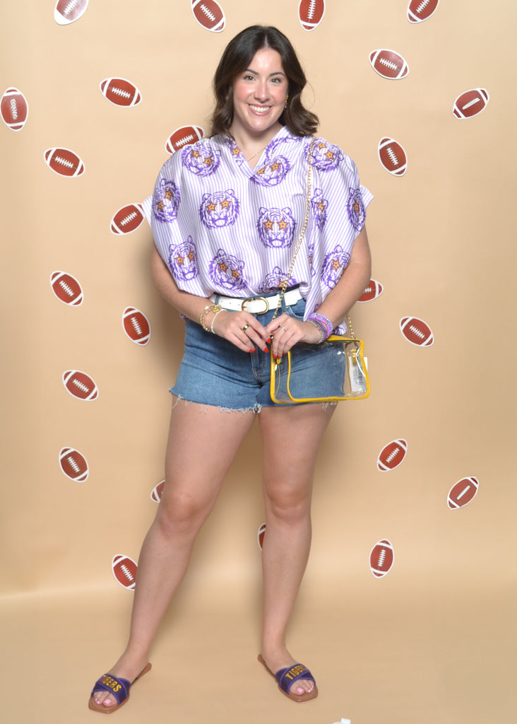 Woman posing against a beige background with football graphics